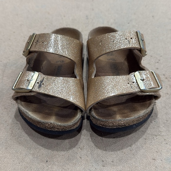 Kids gold and Brown Birkenstock Sandals
28 translates to an 11 1/2 or 12 - Picture 2 of 5